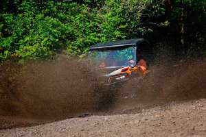 Orange Vehicle Flying Dirt